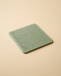 CalmBowl Slow Feeder Lick Mat - sage green textured silicone mat on cream background