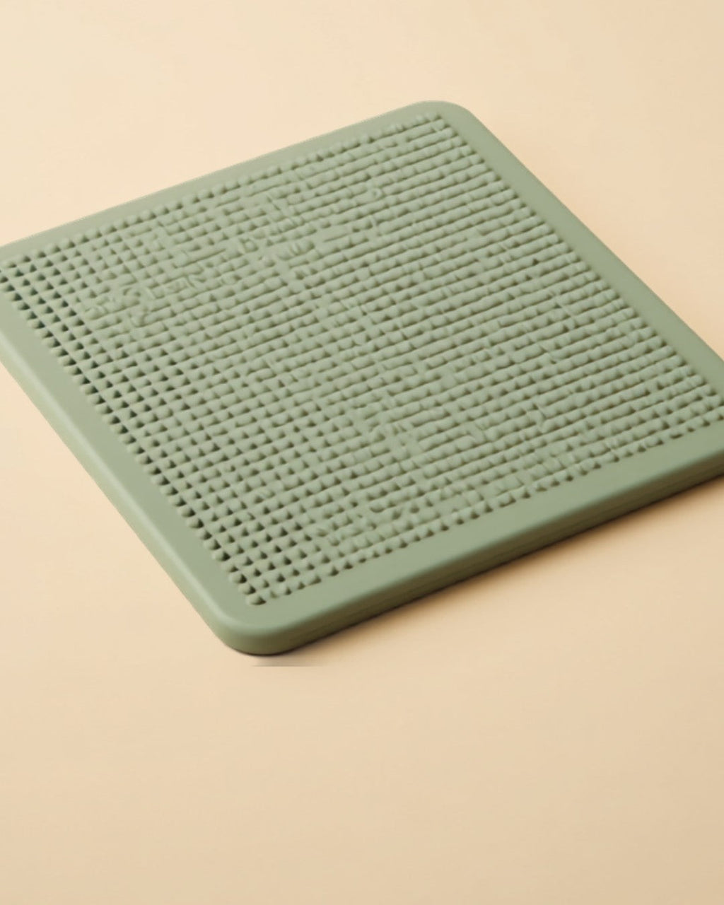 CalmBowl Slow Feeder Lick Mat - close-up of textured silicone surface